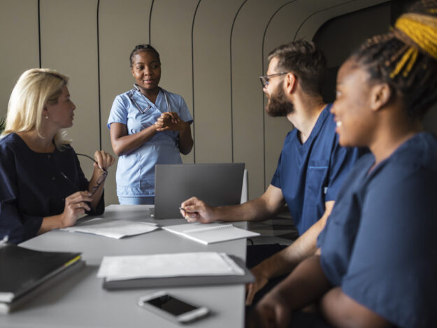 side-view-healthcare-professionals-meeting